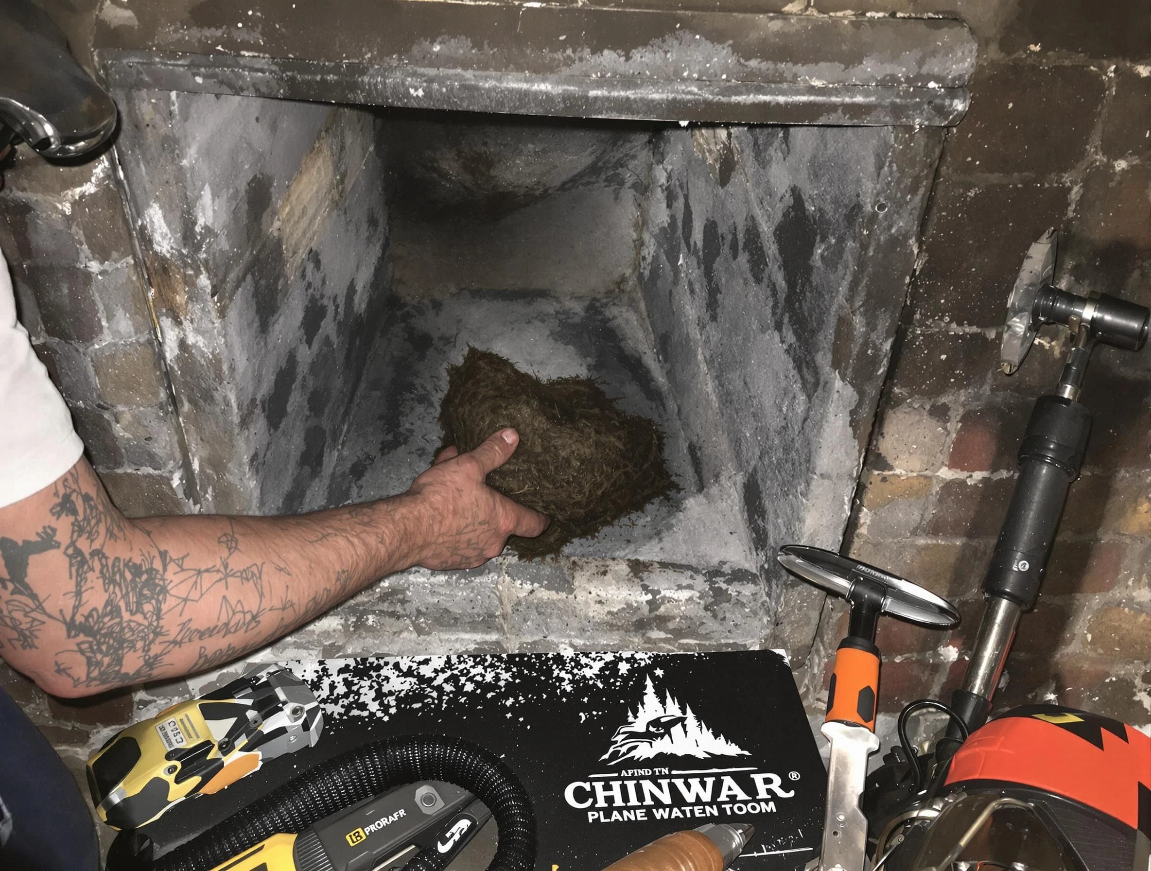 Taunton Chimney Sweep safely removing debris and screening chimney in Taunton, MA
